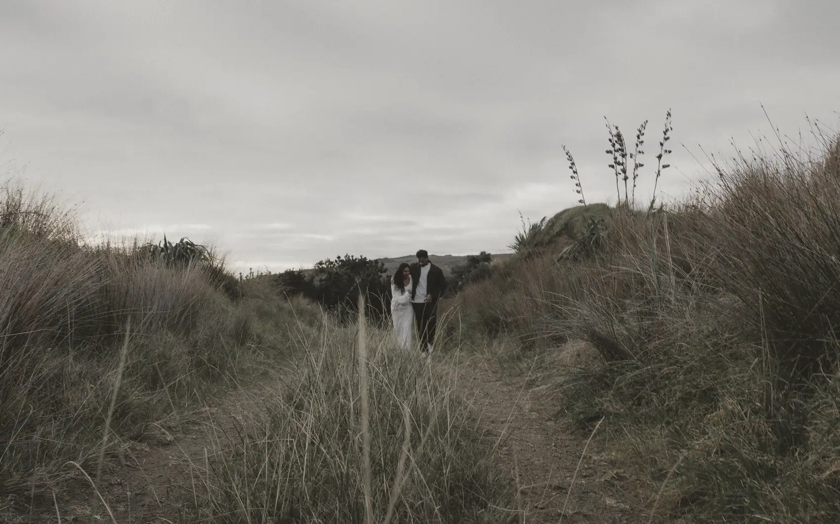 Jerald and Divya walking a coastal path