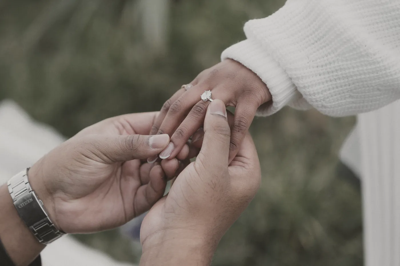 Jerald placing the ring on Divya’s finger